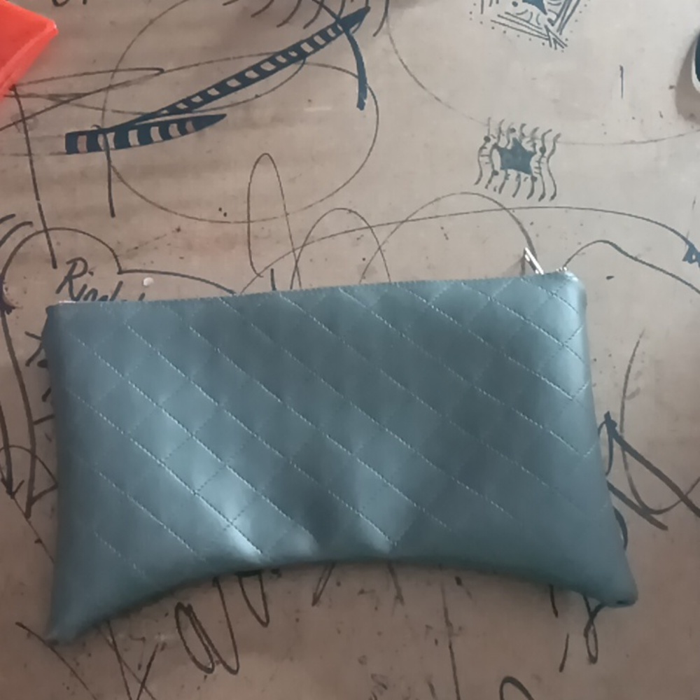 Quilted clutch w/ red zipper